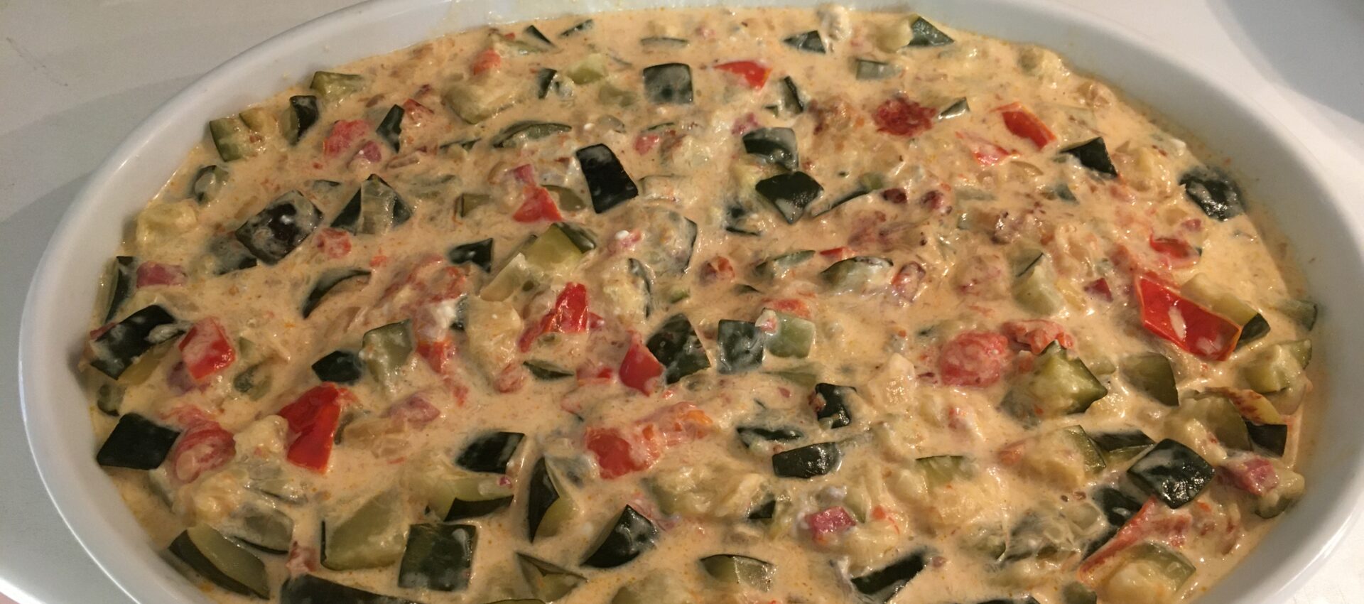 Courgettes au chèvre, lardons et tomates